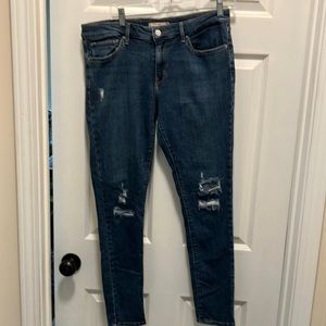 Levi’s 711 skinny jean size 32 distressed knees, iconic, gold stitching